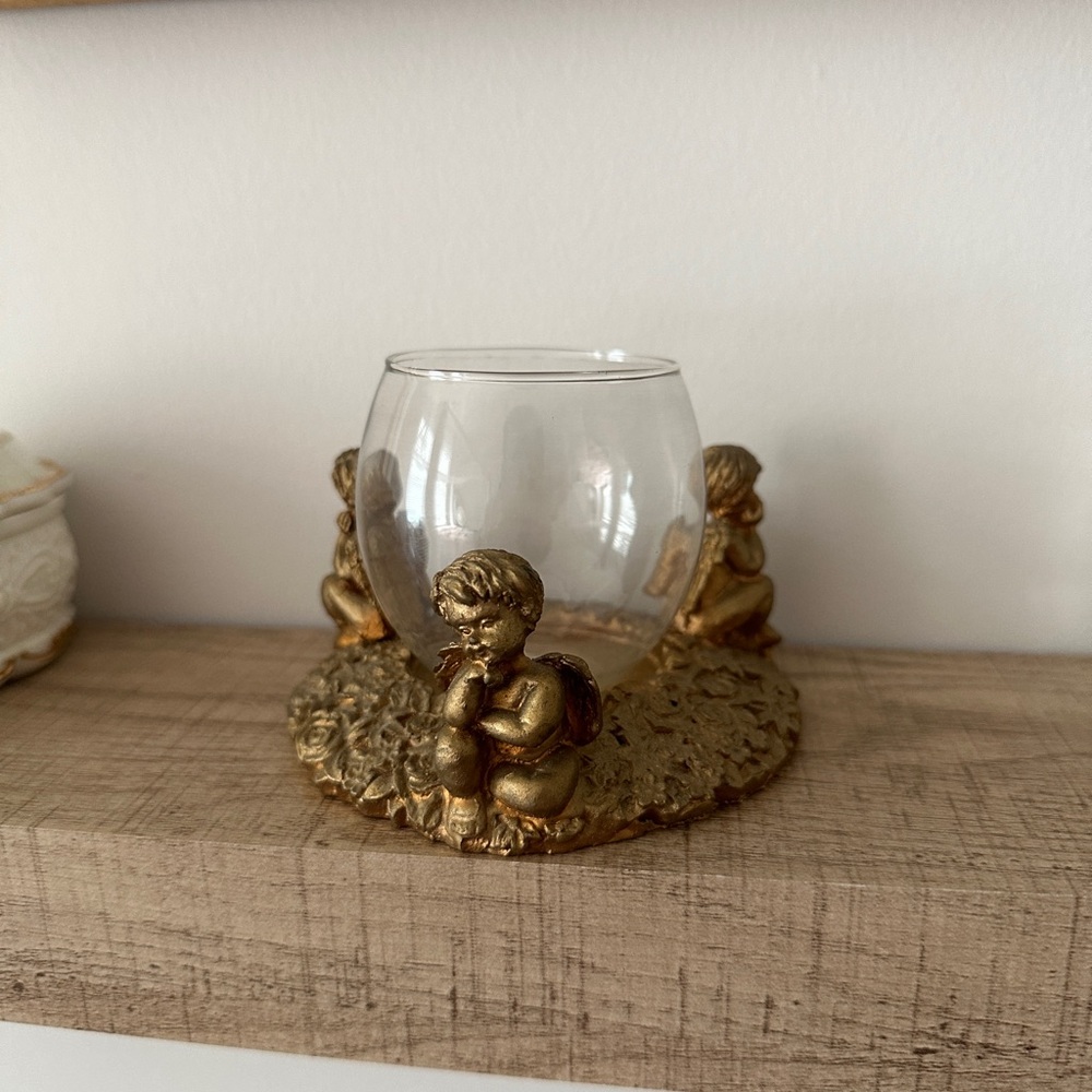 Gold angel candle holder.